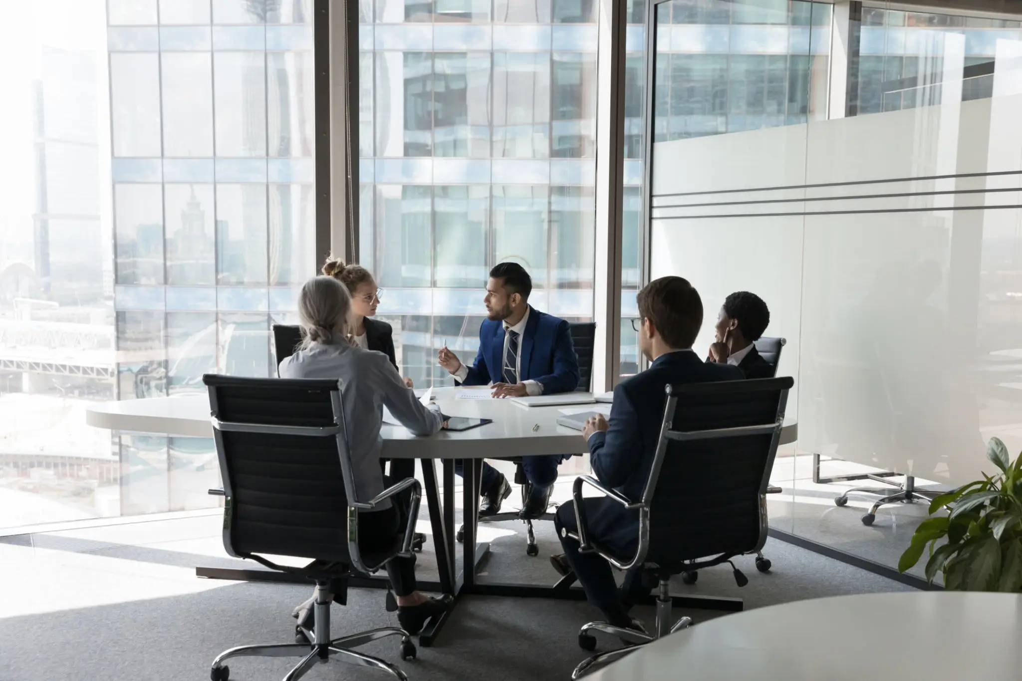 Modern bank operations team reviewing performance and controls